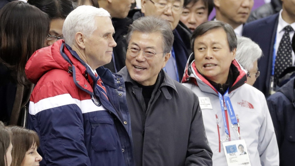 Mike Pence, centre left and Moon Jae-in