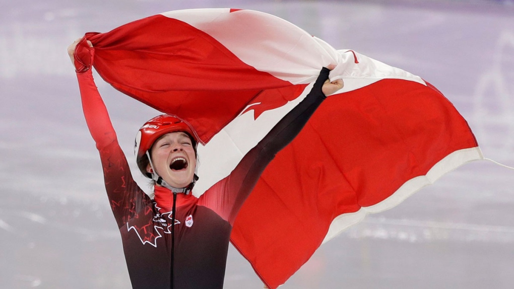 Kim Boutin of Canada celebrates after winning the 