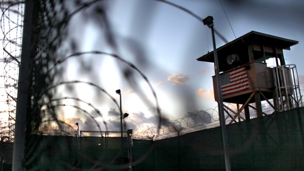 In this photo taken Wednesday, May 13, 2009, and reviewed by the U.S. military, the sun rises over the detention facility at Guantanamo Bay U.S. Naval Base, in Cuba. (AP / Brennan Linsley)