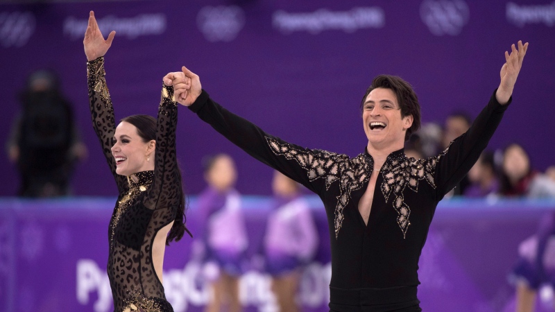 Canada's Tessa Virtue and Scott Moir salutes the crowd following their performance the ice dance figure skating short program at the Pyeongchang Winter Olympics Monday, Feb. 19, 2018 in Gangneung, South Korea. (THE CANADIAN PRESS/Paul Chiasson)