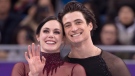 Ice dance gold medalists Canada's Tessa Virtue and Scott Moir look up to the crowd during victory ceremonies at the Pyeongchang Winter Olympics Feb. 20, 2018 in Gangneung, South Korea. THE CANADIAN PRESS/Paul Chiasson