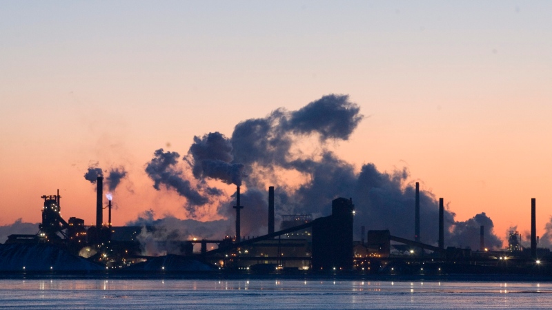 Steel plants are seen across the bay at sunrise in Hamilton, Ont. Wednesday Feb. 7, 2007 (CP PHOTO/Adrian Wyld)