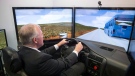 Bill Blair, then-parliamentary secretary, sits in a driving simulator meant to simulate the effects of driving under the influence of cannabis, during a photo opportunity at Centre for Addiction and Mental Health (CAMH) in Toronto on Wednesday January 24, 2018. THE CANADIAN PRESS/Chris Young