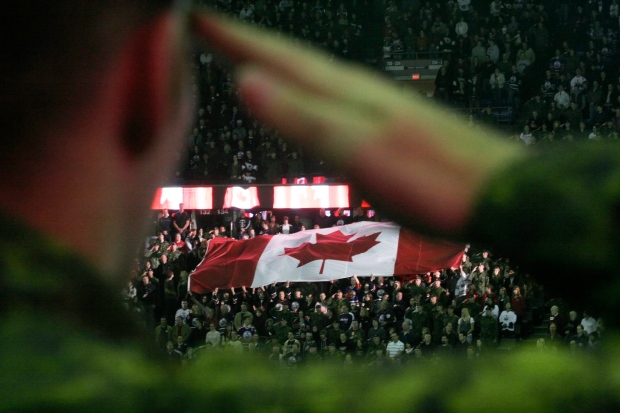 A Canadian soldier salutes