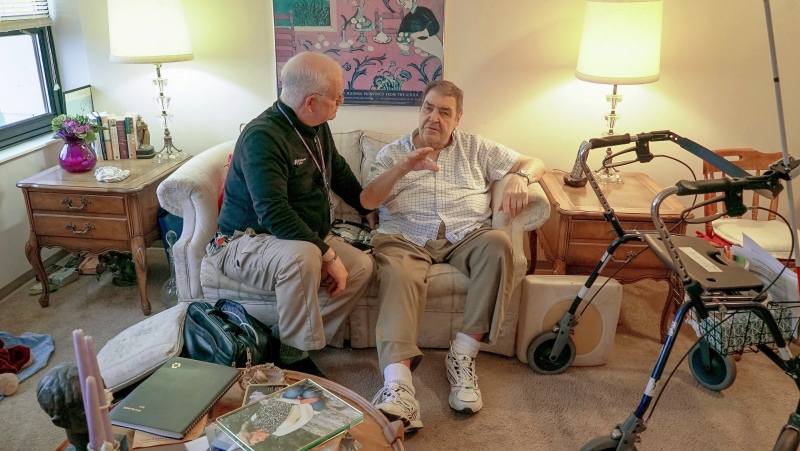 Nurse practitioner Dwayne Dobschuetz, left, visits patient Marvin Shimp, at Shimp's home in Chicago on Jan. 10, 2018. (Teresa Crawford/AP Photo)