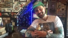 Leopold Tavern’s managing partner Ryan Johnston hugs bar mascot Giuseppe. The stuffed duckling was recently stolen, albeit briefly, from the bar. (Angelina Irinici/CTV Saskatoon)
