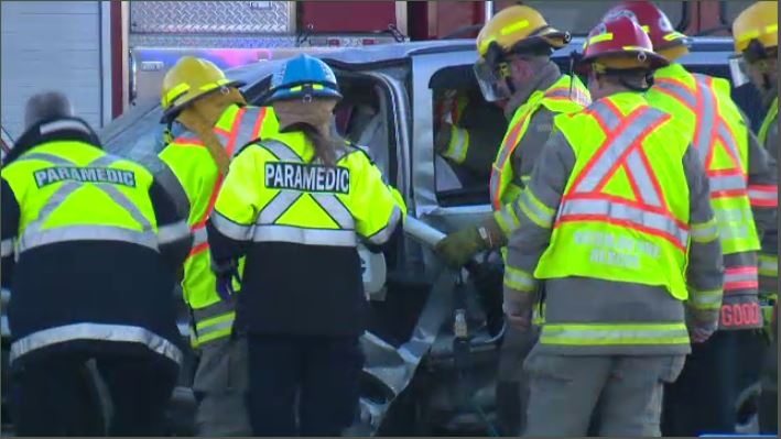 Crews work to free driver after two-vehicle crash 