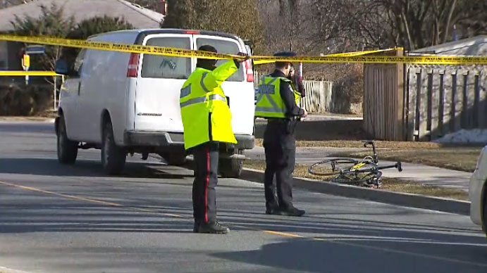 A cyclist is dead after he collided with the back of a delivery van in North York's Don Mills neighbourhood on March 20, 2018.