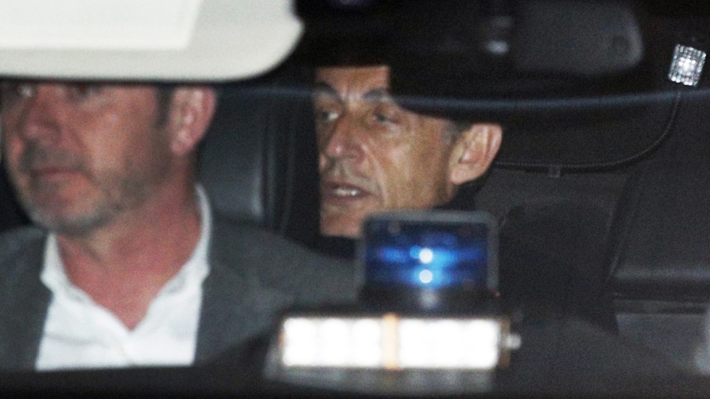 Former French President Nicolas Sarkozy, right