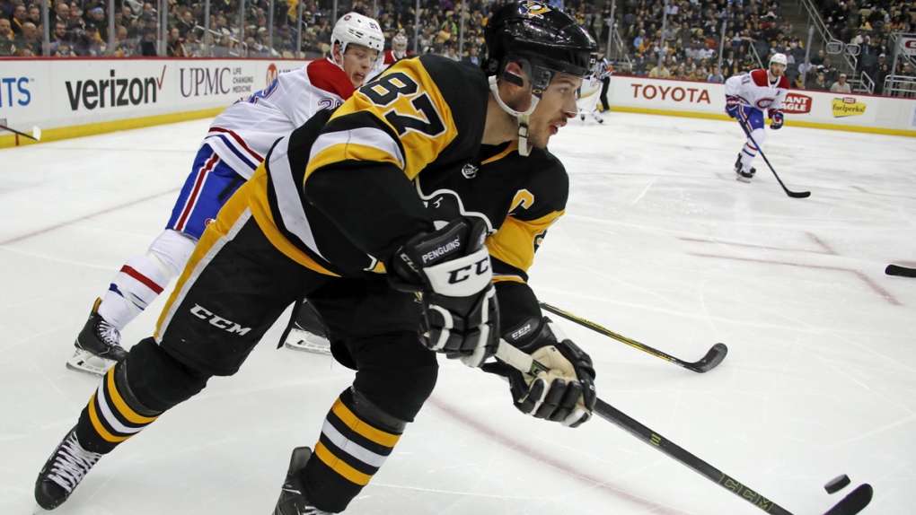 Pittsburgh Penguins' Sidney Crosby makes a pass