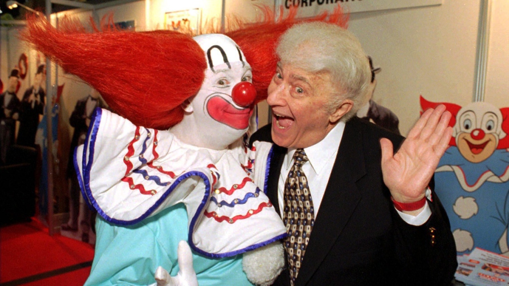 A 'Bozo' poses with the clown character's creator