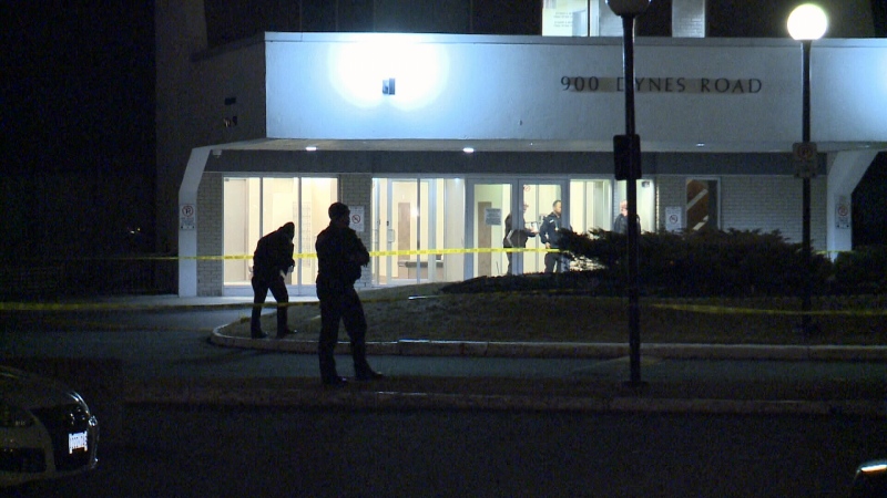 Police investigate the scene outside of a building in the 900-block of Dynes Rd where an occupant of a white SUV fired multiple shots at an adult man as he was walking toward the front entrance on March 31, 2018.