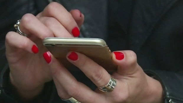 Texting with red finger nails 