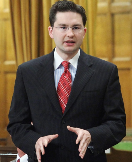 Pierre Poilievre, parliamentary secretary to the prime minister, speaks during question period, in Ottawa, on Friday, May 29, 2009. (Fred Chartrand / THE CANADIAN PRESS)
