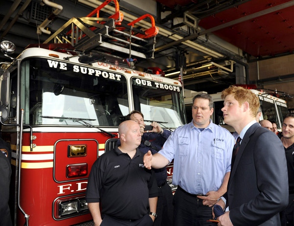 Britain's Prince Harry, right, speaks with Cpt. Joseph McHugh, center, and firefighter Anthony Henry, left, both of the New York City Fire Department's Ladder 10/Engine 10 after visiting the site of the Sept. 11 terrorist attack in New York, Friday, May 29, 2009. (AP / Stephen Chernin)