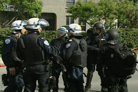 Montreal police in riot gear forced dozens of squatters out of an abandoned building on St. Patrick St. in Point St. Charles on Saturday, May 30, 2009. 