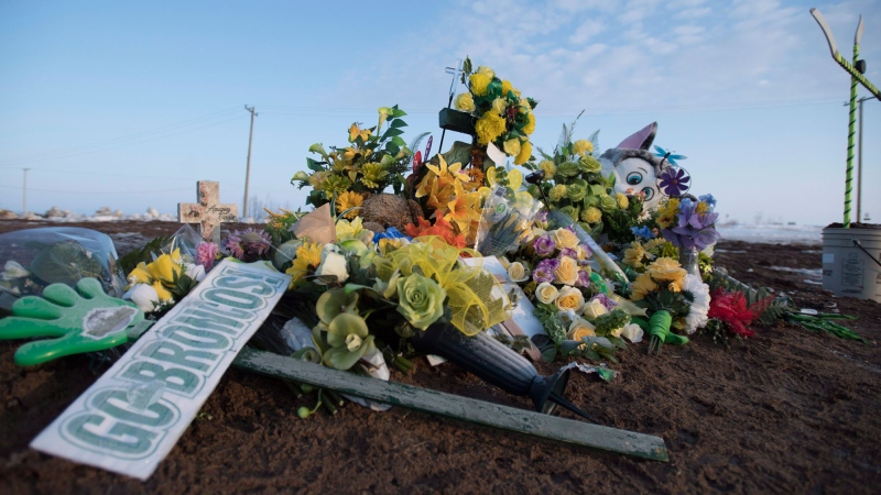 A makeshift memorial is pictured at the intersection of of a fatal bus crash near Tisdale, Sask., Tuesday, April, 10, 2018. THE CANADIAN PRESS/Jonathan Hayward