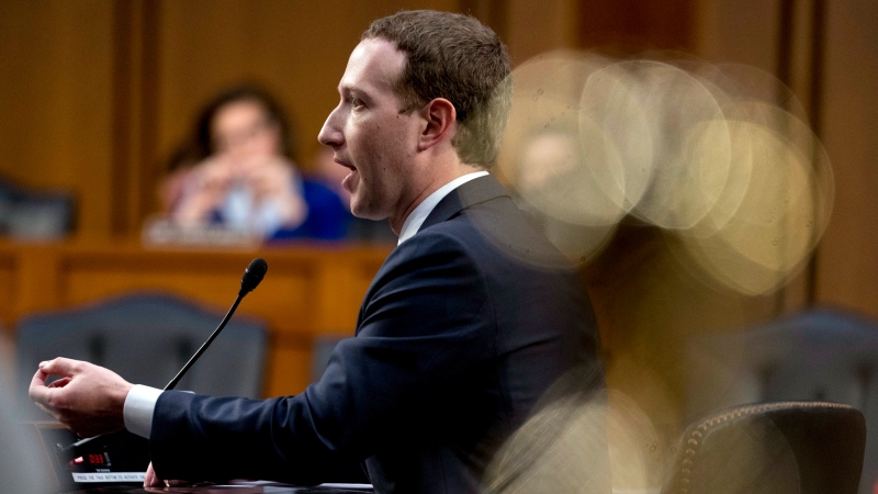Facebook CEO Mark Zuckerberg testifies before a joint hearing of the Commerce and Judiciary Committees on Capitol Hill in Washington, Tuesday, April 10, 2018, about the use of Facebook data to target American voters in the 2016 election. (AP Photo/Andrew Harnik)