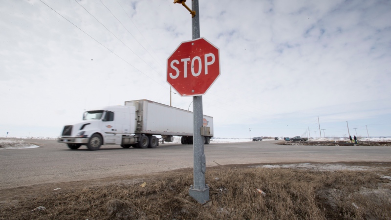 The stop sign on highway 335 is seen at the intersection of highway 35 near Tisdale, Sask., Tuesday, April, 10, 2018. This is the intersection where a bus carrying the Humboldt Broncos hockey team crashed into a truck en route to Nipawin for a game Friday night killing 15 and sending over a dozen more to the hospital. (THE CANADIAN PRESS/Jonathan Hayward)