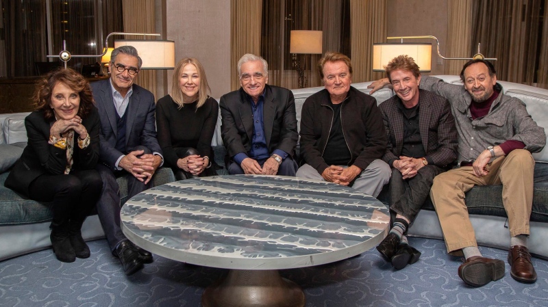 This undated image released by Netflix shows director Martin Scorsese, centre, with the cast of the Canadian sketch comedy show 'SCTV,' from left, Andrea Martin, Eugene Levy, Catherine O'Hara, Dave Thomas, Martin Short and Joe Flaherty. (Netflix via AP)
