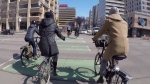 Cyclists cross 109 Street in downtown Edmonton in this file photo (CTV News Edmonton).