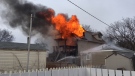 Flames shoot from a home on Saskatoon's Avenue C North on Monday, April 16, 2018. (Saskatoon Fire Department)