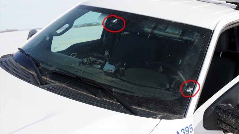 A photo released by Saskatchewan RCMP shows two bullet holes in the windshield of a cruiser that was involved in a shootout with the suspects in a taxi hijacking. (SOURCE: SASKATCHEWAN RCMP)
