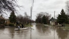 Kingsville residents make the most out of flooding on Heritage Road in Kingville, Ont., Sunday, April 15, 2018. (Melanie Borrelli / CTV Windsor)