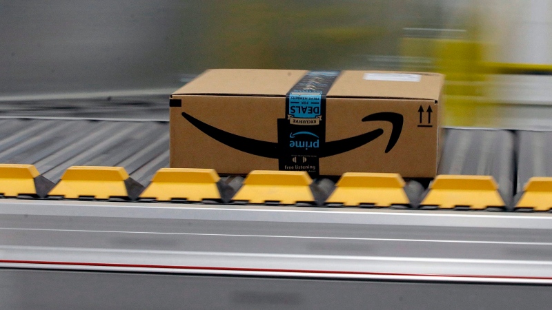 In this Feb. 9, 2018, file photo, a box for an Amazon prime customer moves through the new Amazon Fulfillment Center in Sacramento, Calif. (AP Photo/Rich Pedroncelli)