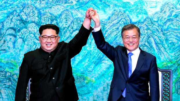 Kim Jong Un, left, and Moon Jae-in