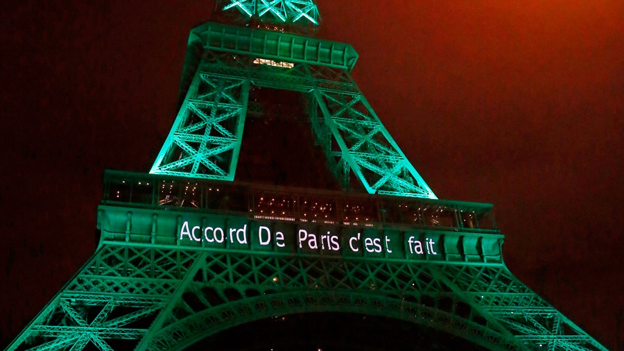 Eiffel Tower lit up in green to mark Paris Agreeme