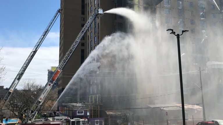 Ottawa Firefighters tackle a three-alarm blaze at a high-rise under construction on Champagne Avenue South, April 30, 2018. (Claudia Cautillo) 