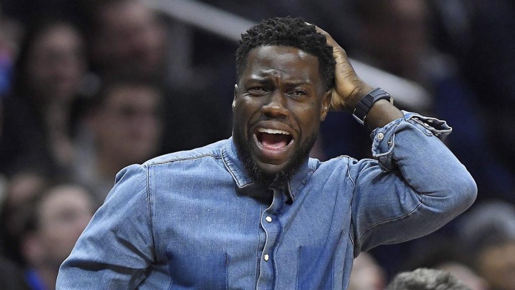 Kevin Hart watches an NBA basketball game in L.A.
