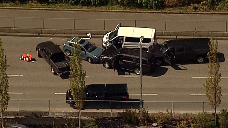A number of vehicles remain stopped with their doors open following a shooting incident at the Departure Bay ferry terminal. May 8, 2018. (CTV Chopper 9) 