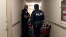Toronto police officers guard the Thorncliffe Park apartment as forensic investigators comb the unit for evidence related to the Bruce McArthur case.