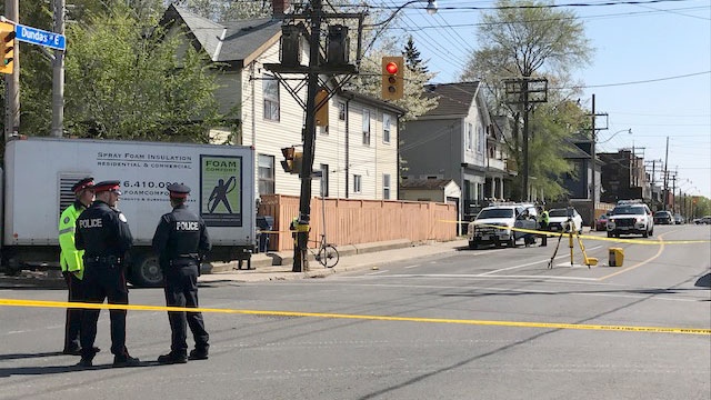 Toronto police investigate a crash in Leslieville where a cyclist was fatally struck by a truck on May 16, 2018. 