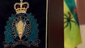 An RCMP insignia hangs from a podium at Depot Division in Regina, Saskatchewan on Thursday April 19, 2018. (THE CANADIAN PRESS/Michael Bell)
