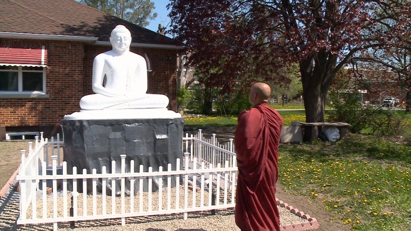 Buddha statue in front of Hilda Jayawardenaramaya Buddhist Temple on Heron Road in Ottawa.