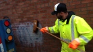 Crews work to clean up graffiti spray-painted on a Muslim school in Scarborough. (Cam Woolley/ CP24)