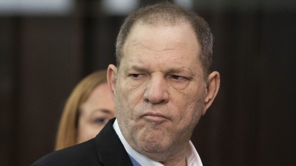Harvey Weinstein listens in court