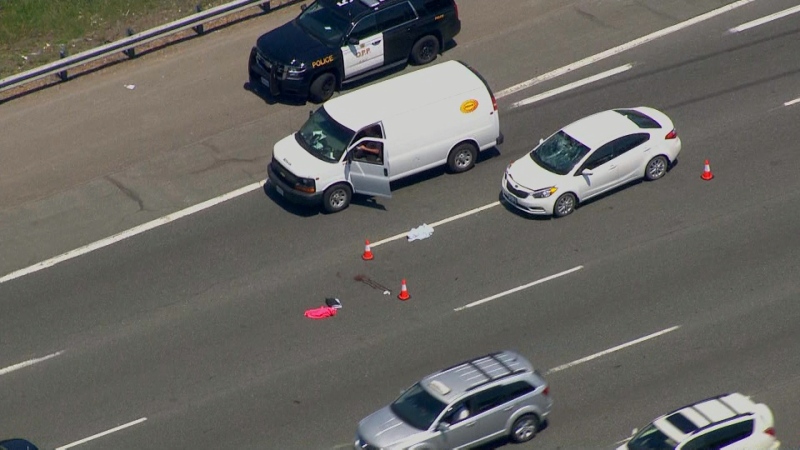 Two vehicles are shown on scene after a pedestrian was struck on Hwy. 401 after exiting their disabled vehicle. 