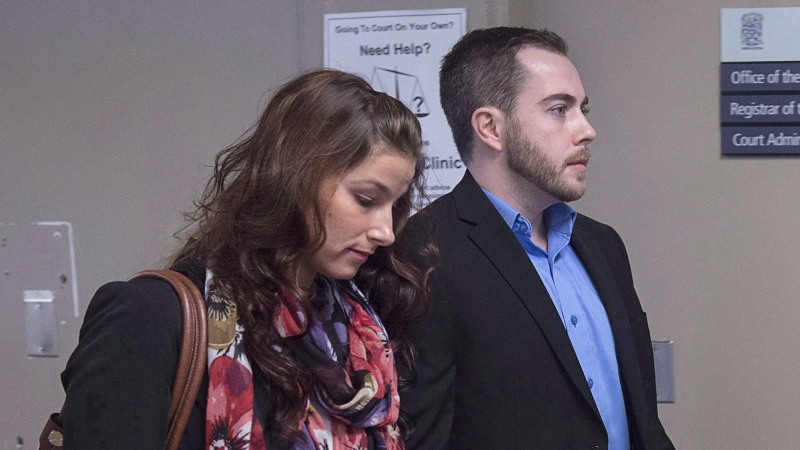 Christopher Calvin Garnier, convicted of second-degree murder in the death of Truro police officer Const. Catherine Campbell, walks with girlfriend Brittany Francis (left) at Nova Supreme Court for the start of his trial in Halifax on Monday, Nov. 20, 2017. (The Canadian Press/Andrew Vaughan)