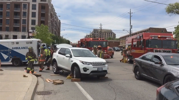 Firefighters are shown on scene after a vehicle collided with an E-bike near Dundas and Old Dundas Street. (Twitter/@BrunoWilker)