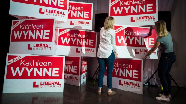Staff members prepare for Premier Kathleen Wynne's election night event at York Mills Gallery in Toronto on Thursday, June 7, 2018. (THE CANADIAN PRESS/ Tijana Martin)