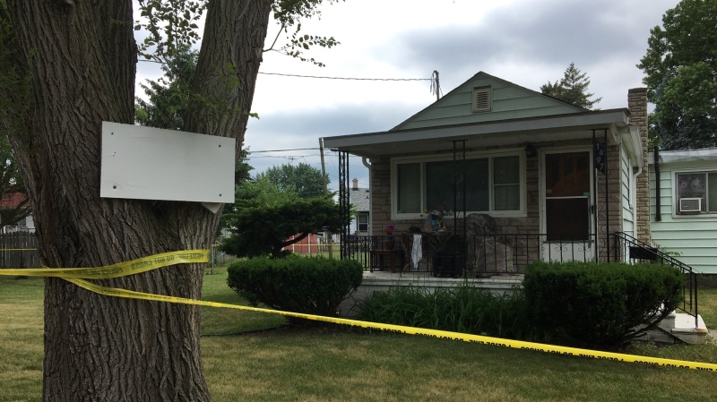 Police tape surrounds a home after a homicide at 1497 Everts Ave., in Windsor, Ont., on Wednesday, June 20, 2018. (Ricardo Veneza / CTV Windsor)  