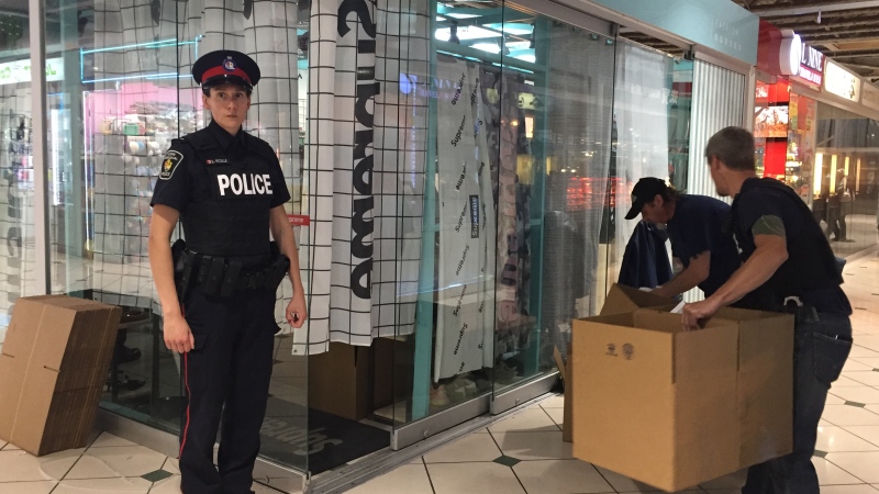 York Regional Police officers conduct a series of raids at stores inside Markham's Pacific Mall on June 27, 2018.