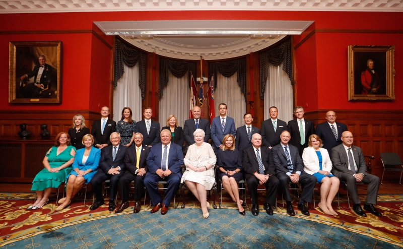 Premier Doug Ford sits with members of his cabinet prior to being sworn in during a ceremony at Queen's Park in Toronto on Friday, June 29, 2018. THE CANADIAN PRESS/Mark Blinch