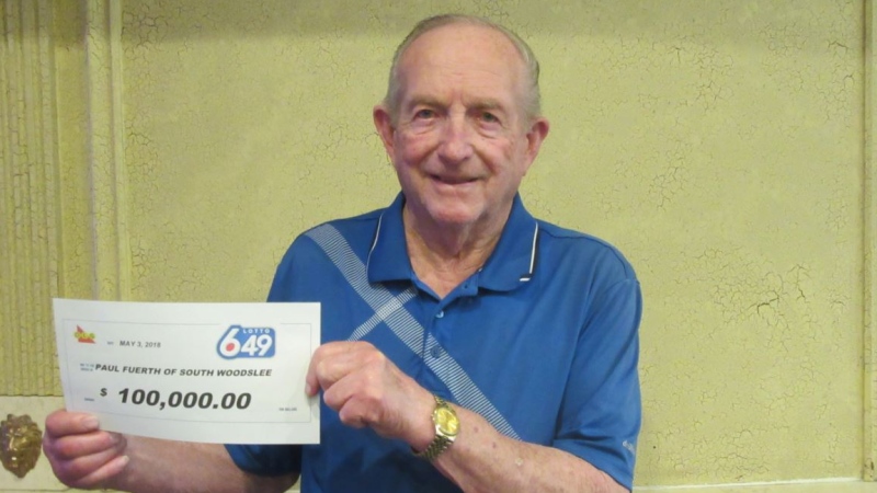 Paul Fuerth of South Woodslee poses with a $100,000 cheque after winning the Feb. 14, 2018 draw of Lotto 6/49. (Courtesy of OLG)