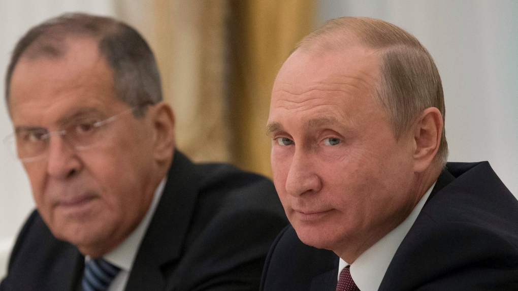 Vladimir Putin, right, and Sergey Lavrov