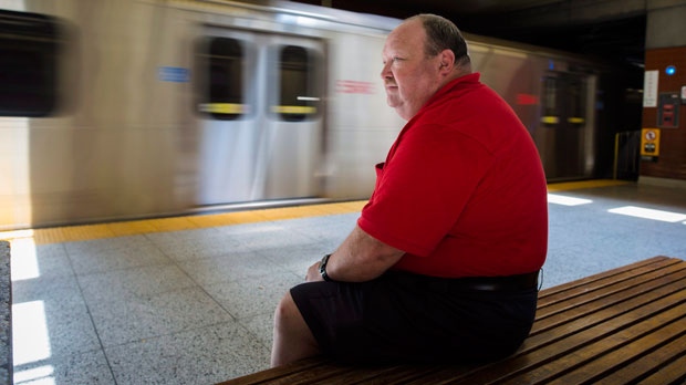 Kevin Freeman, a volunteer with the TTC's peer support program, poses for a photo at Wilson Station in Toronto on Thursday, July 5, 2018. Hope has emerged from the darkness of death on the subway tracks in Toronto. (THE CANADIAN PRESS/ Tijana Martin)